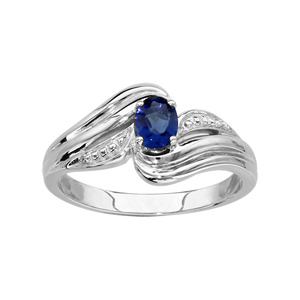 Bague en argent rhodi collection joaillerie oxyde ovale bleu au centre et brins courbs autour - Vue 1