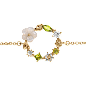 Bracelet en plaqu� or fleur d'oxydes blancs et vert olive et sa fleur de nacre blanche -16+2cm