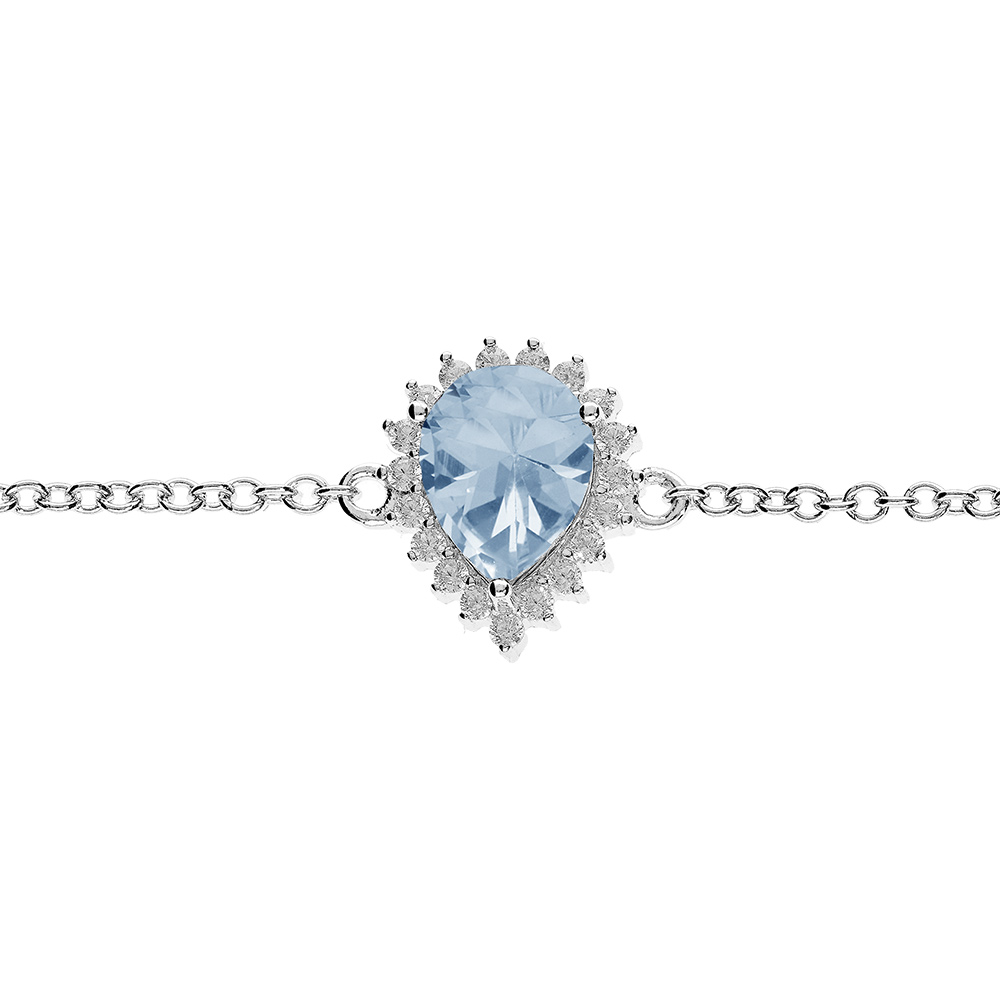 Bracelet en argent rhodié chaîne avec Topaze bleue véritable en forme goutte 8x6 contour oxydes blancs sertis 16+3cm