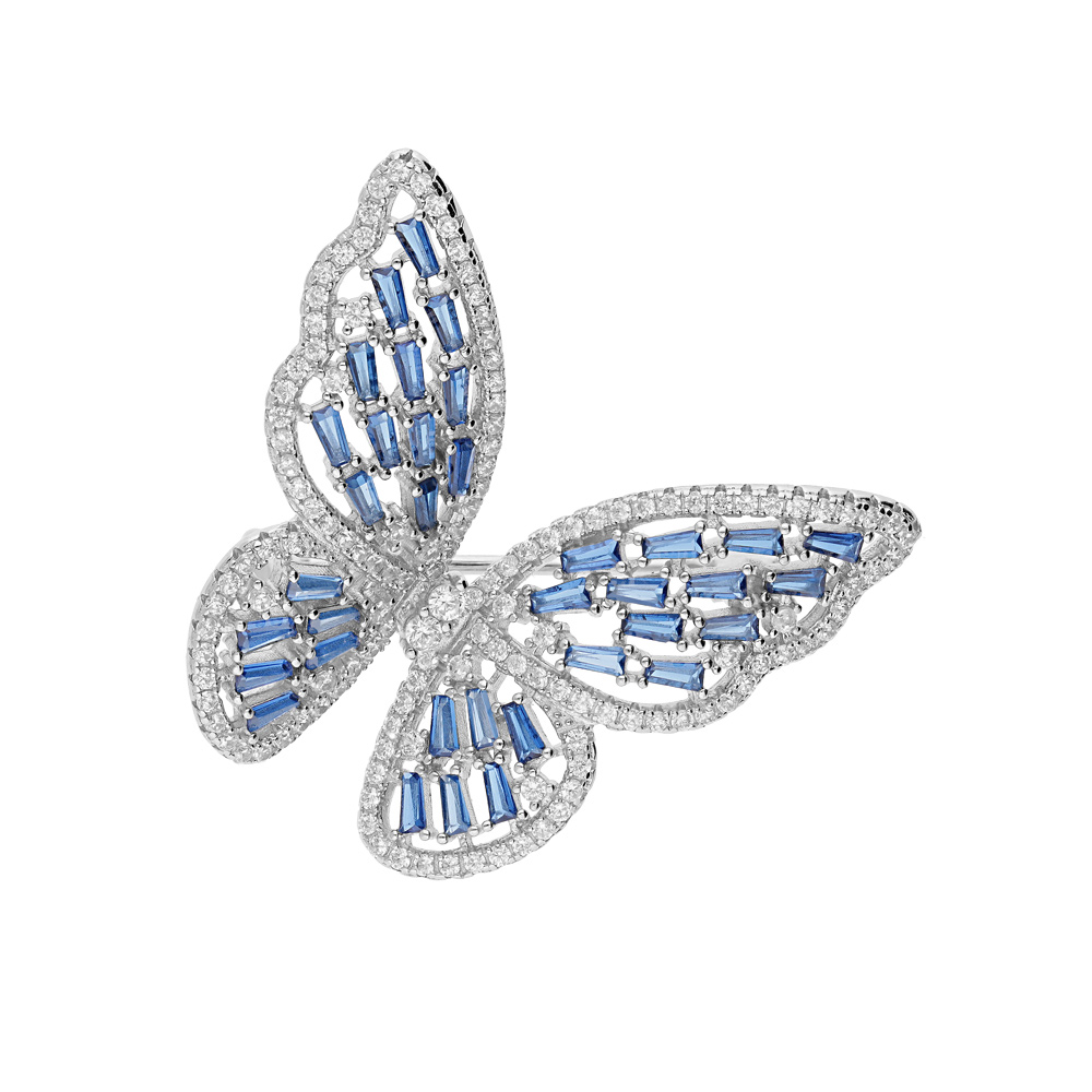 Broche en argent rhodié motif papillon avec oxydes bleus et blancs sertis Broche en argent rhodié motif papillon avec oxydes bleus et blancs sertis