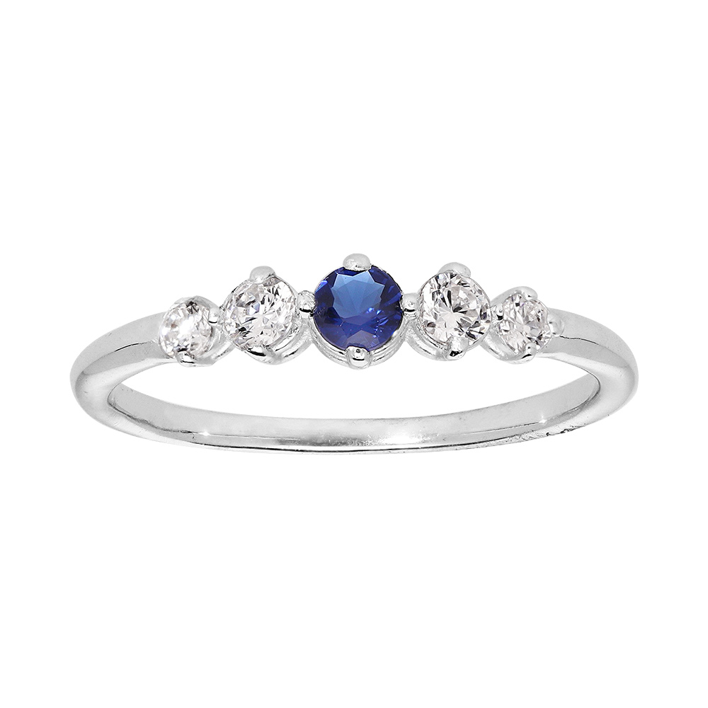 Bague en argent rhodié avec 4 oxydes blancs sertis et 1 au centre bleu nuit