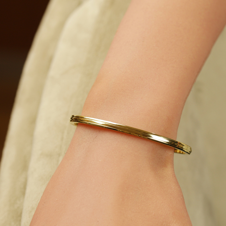 Bracelet jonc en acier dor� articul� avec oxydes blancs sertis - Vue 20