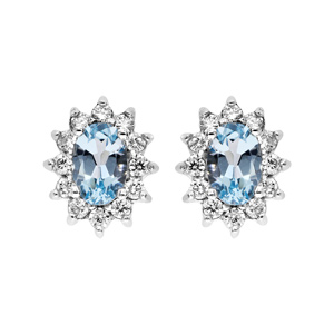 Boucles d’oreille en argent rhodié massif collection joaillerie Topaze bleue ovale avec oxydes blancs et fermoir poussette