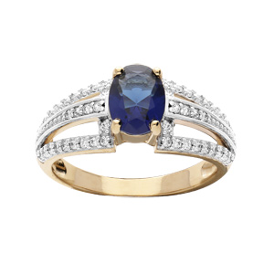 Bague en plaqué or avec oxyde central bleu et 3 rails oxydes blancs sertis