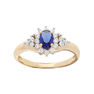 Bague en plaqué or avec oxyde central bleu et contour oxydes blancs sertis